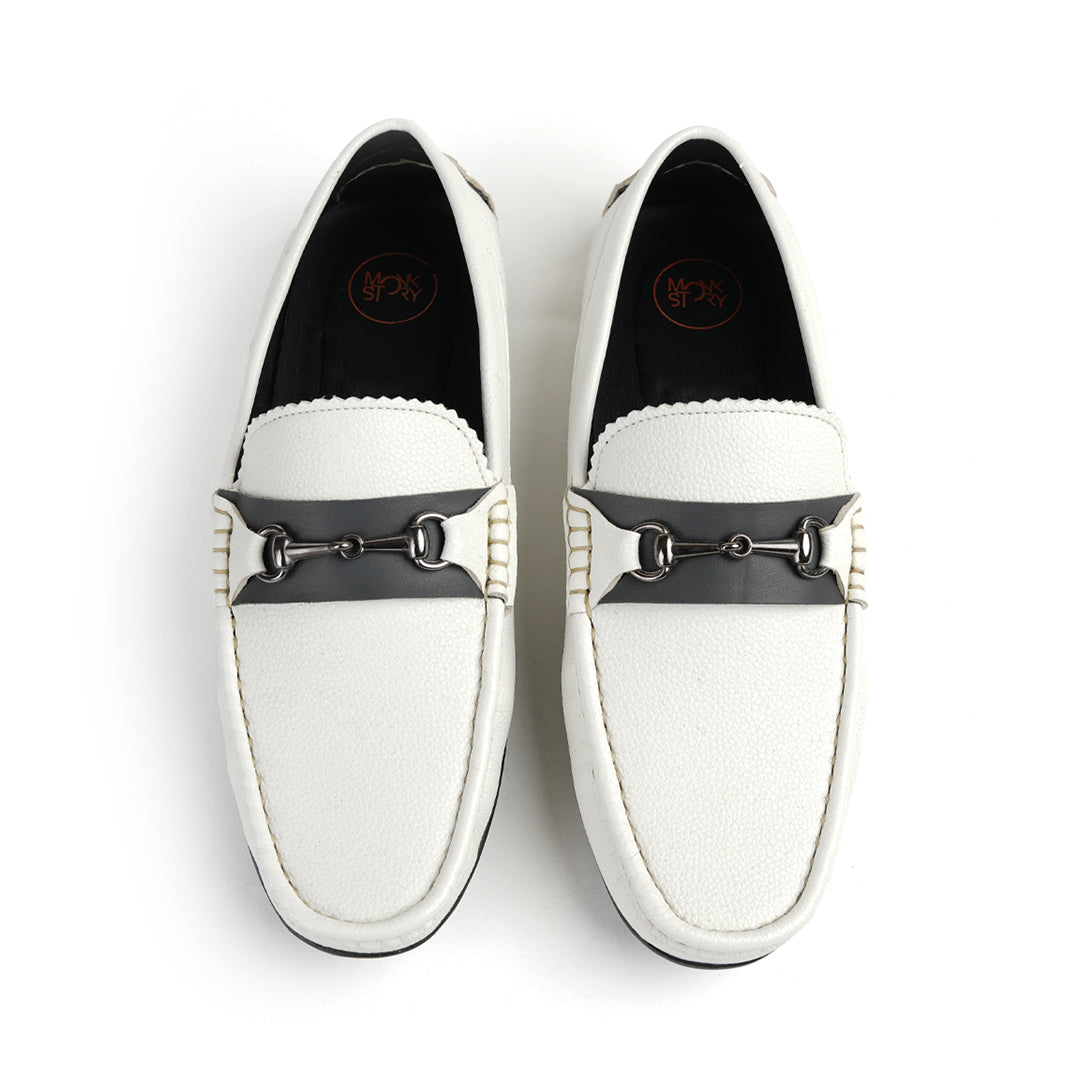 A stylish white Monkstory Horse-bit Driving Shoe with a sleek black buckle, perfect for both fashion-forward individuals and those seeking ultimate comfort.