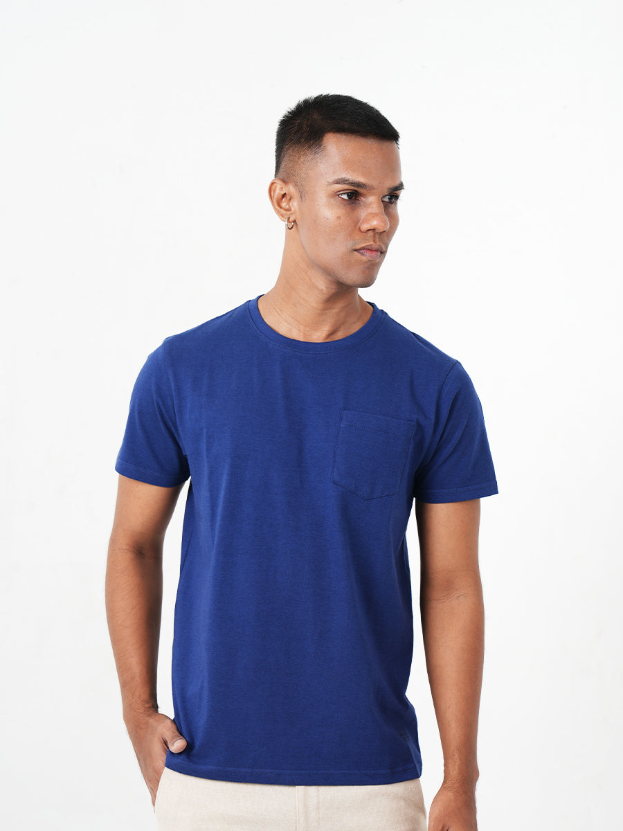 The Monkstory Bamboo Cotton Crew Tee, made of bamboo and cotton, features a man wearing a Midnight Blue t-shirt with a pocket.