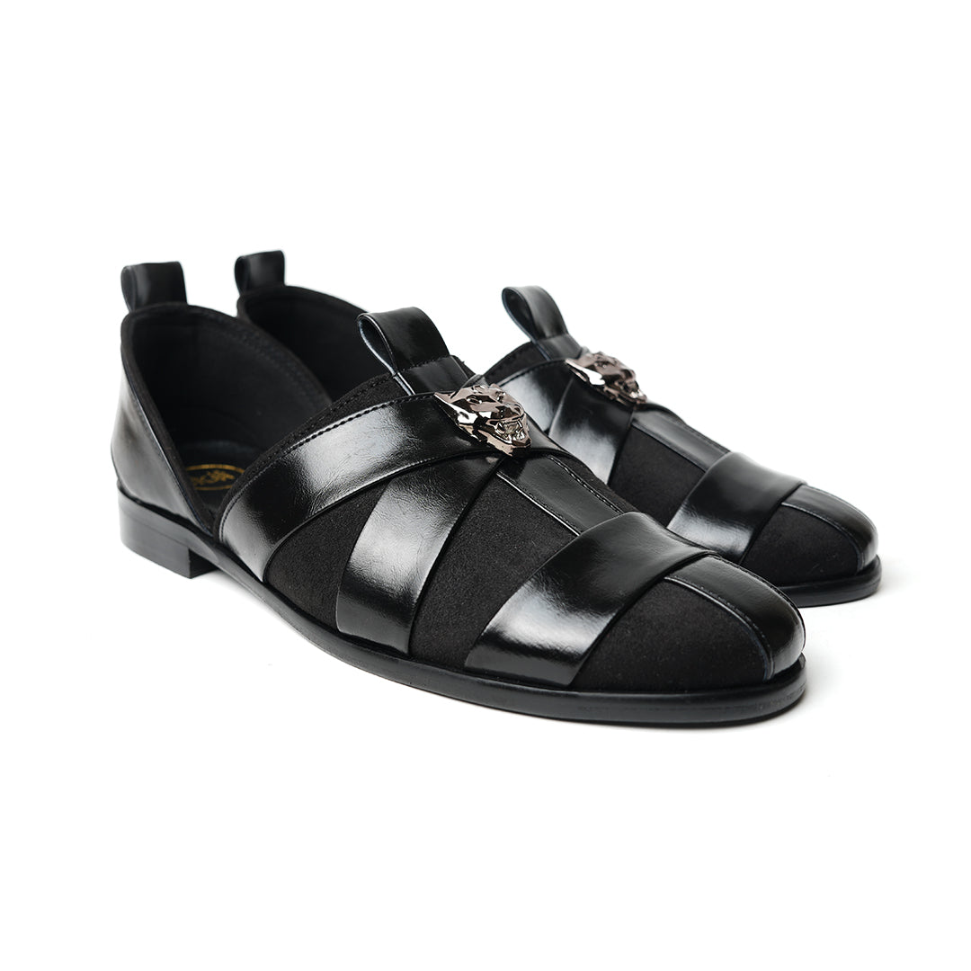 A sophisticated Monkstory Criss Cross Slip-On Sandal - Black leather shoe with straps.