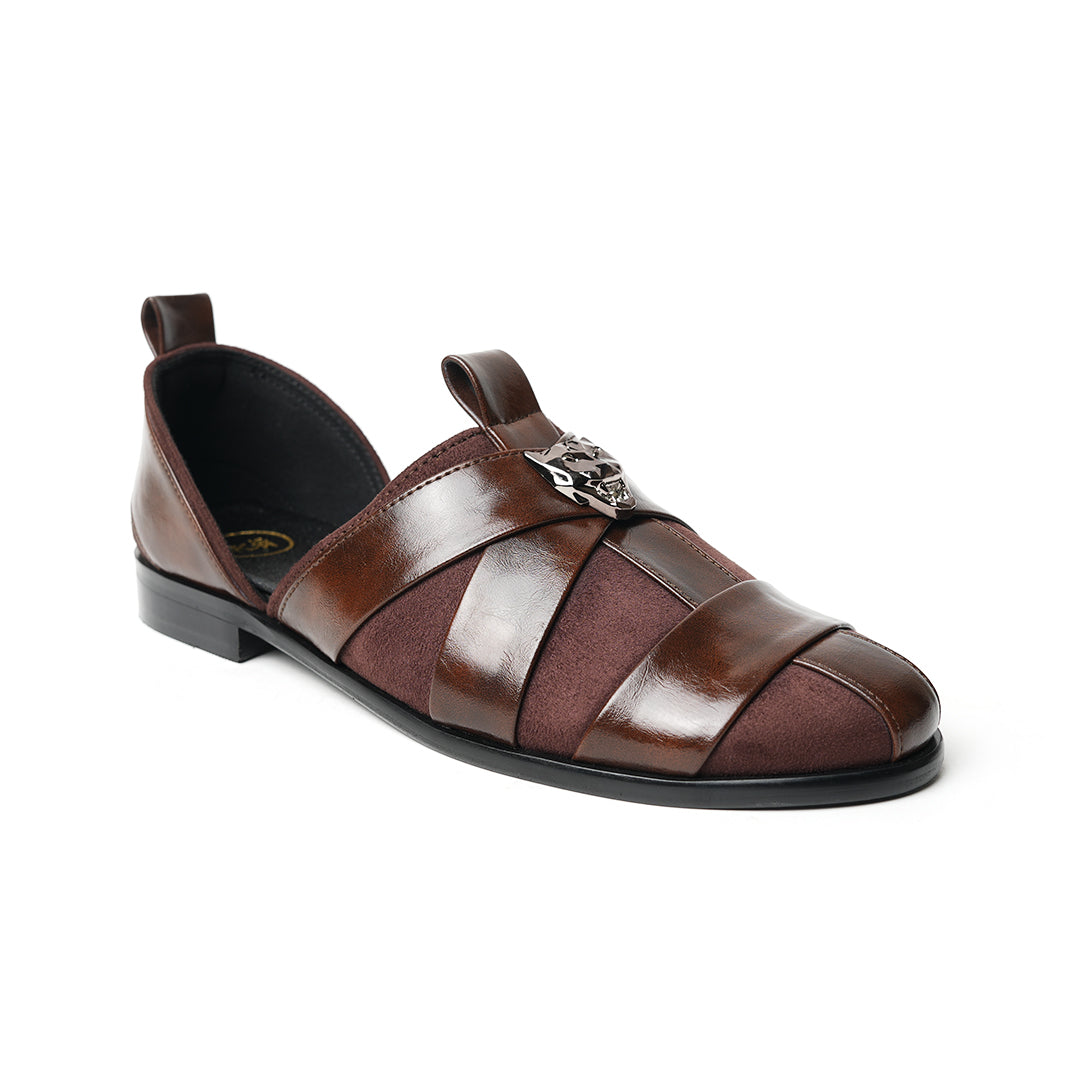 A pair of Monkstory Criss Cross Slip-On Sandals - Brown with elegant straps.