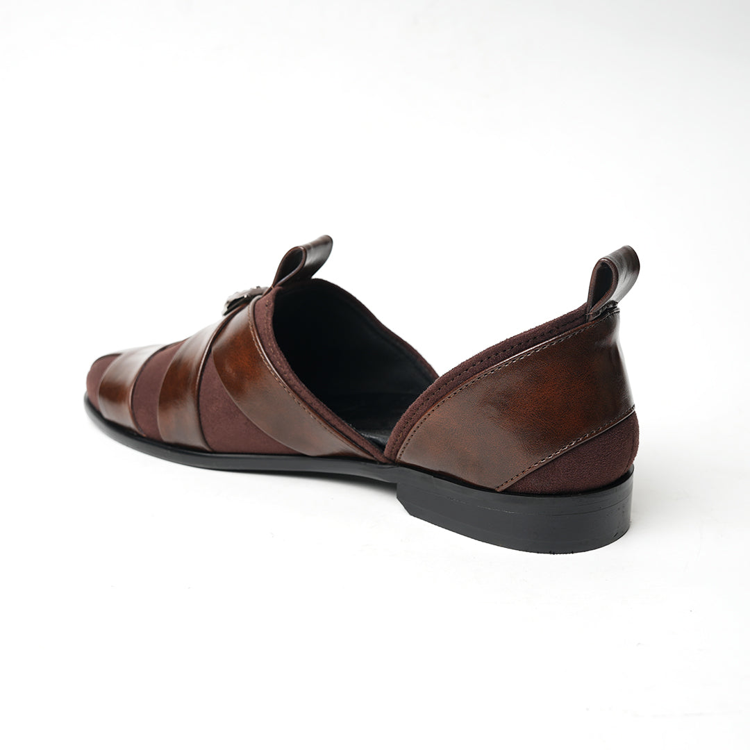 A pair of Monkstory Criss Cross Slip-On Sandals - Brown with elegant straps.