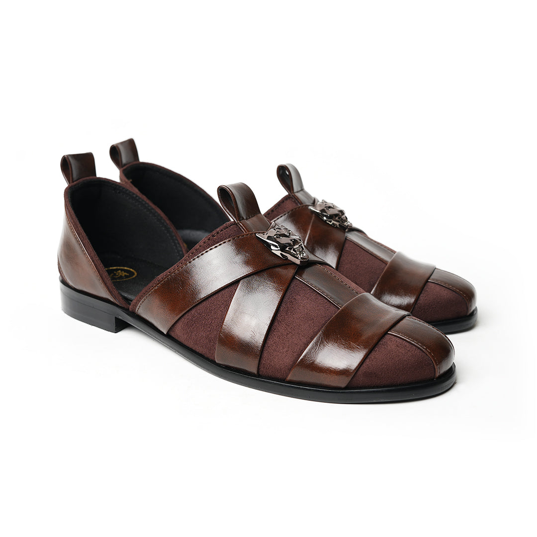 A pair of Monkstory Criss Cross Slip-On Sandals - Brown with elegant straps.
