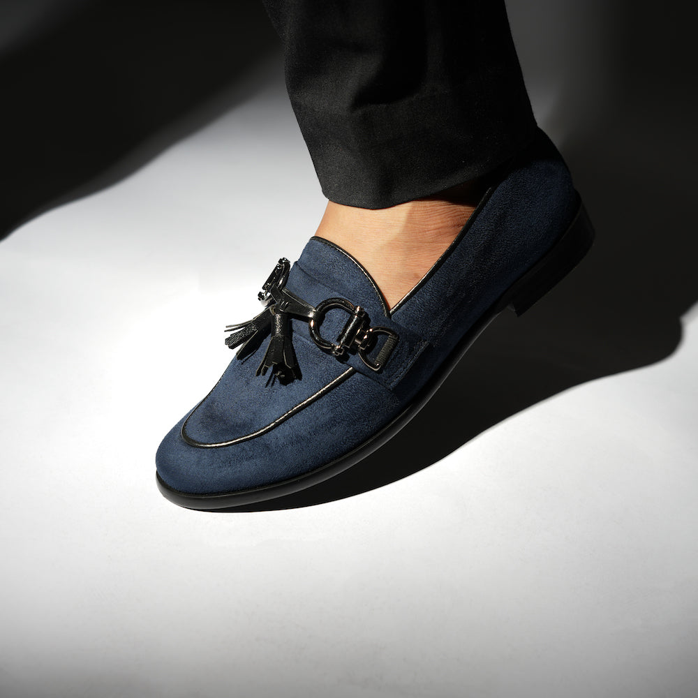 A classic Monkstory Horse-bit Tasseled Slip-Ons blue loafer exuding modern sophistication.