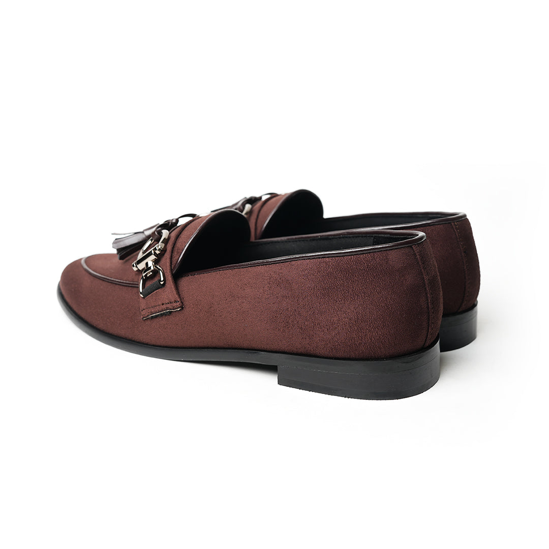 A timeless Monkstory brown loafer with tassels and a buckle, exuding modern sophistication.