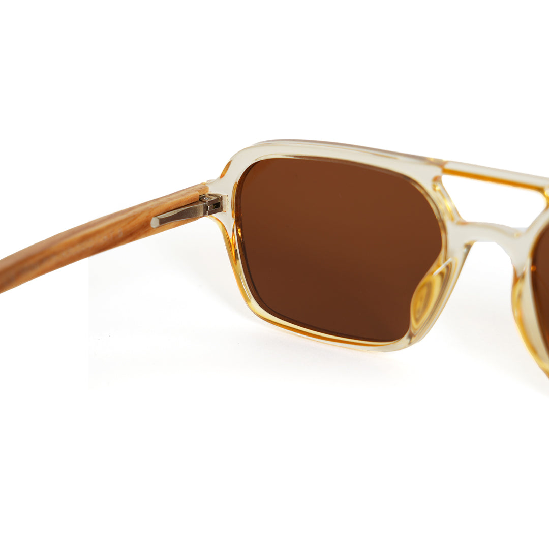 A pair of Monkstory Retro Wood Polarized Unisex sunglasses with transparent brown lenses on a white background.