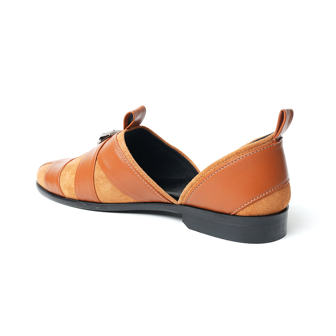 A pair of Monkstory Criss Cross Slip-On Sandal - Tan with an adjustable fit and vegan leather.