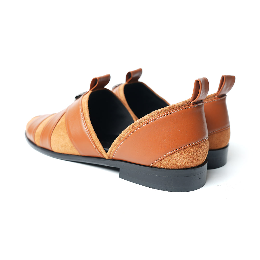 A pair of Monkstory Criss Cross Slip-On Sandal - Tan with an adjustable fit and vegan leather.