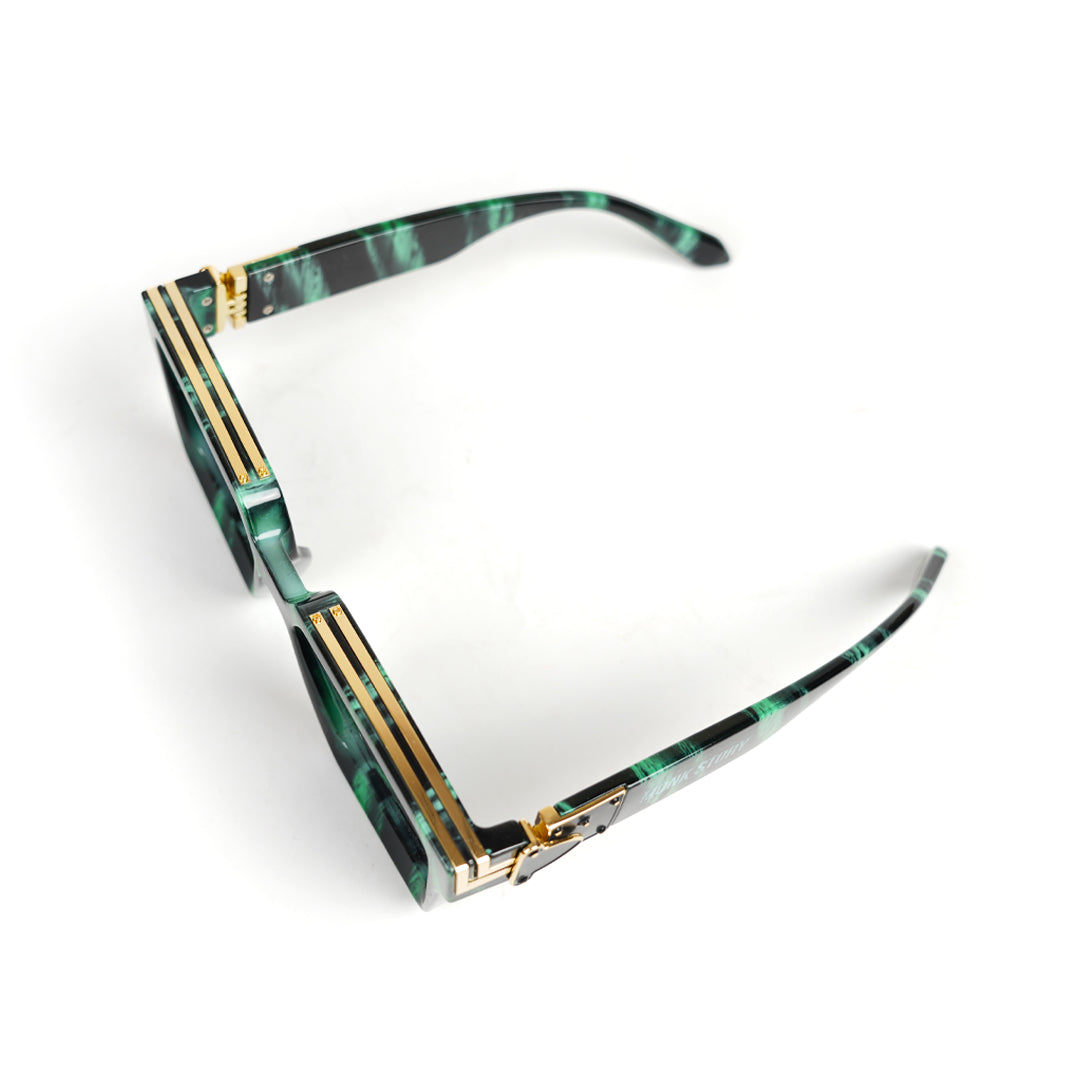 A green Monkstory Millionaire Unisex Wayfarer sunglasses with black lenses designed to protect against UV rays.