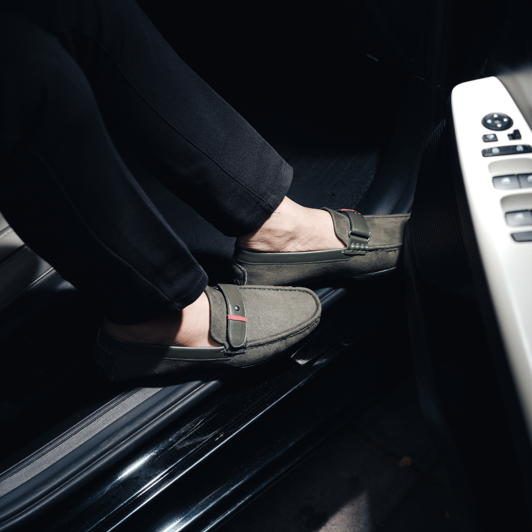 Elevate your style with these comfortable Monkstory olive green driving shoes. Crafted from luxurious suede, these men's loafers feature a striking red buckle for added flair. Perfect for any occasion.