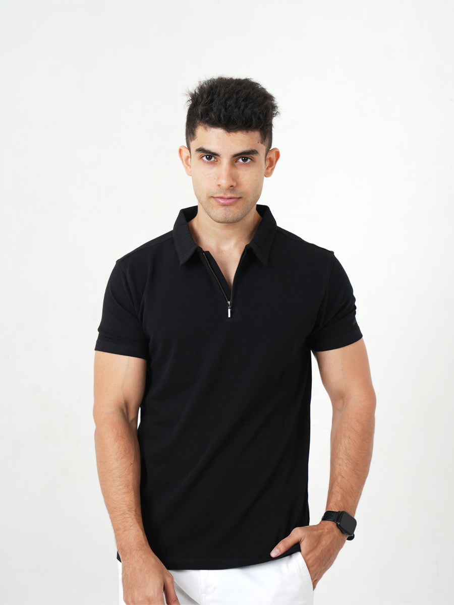 Monkstory young man posing in a Bamboo Cotton Zip-Polo Tee - Midnight Black.