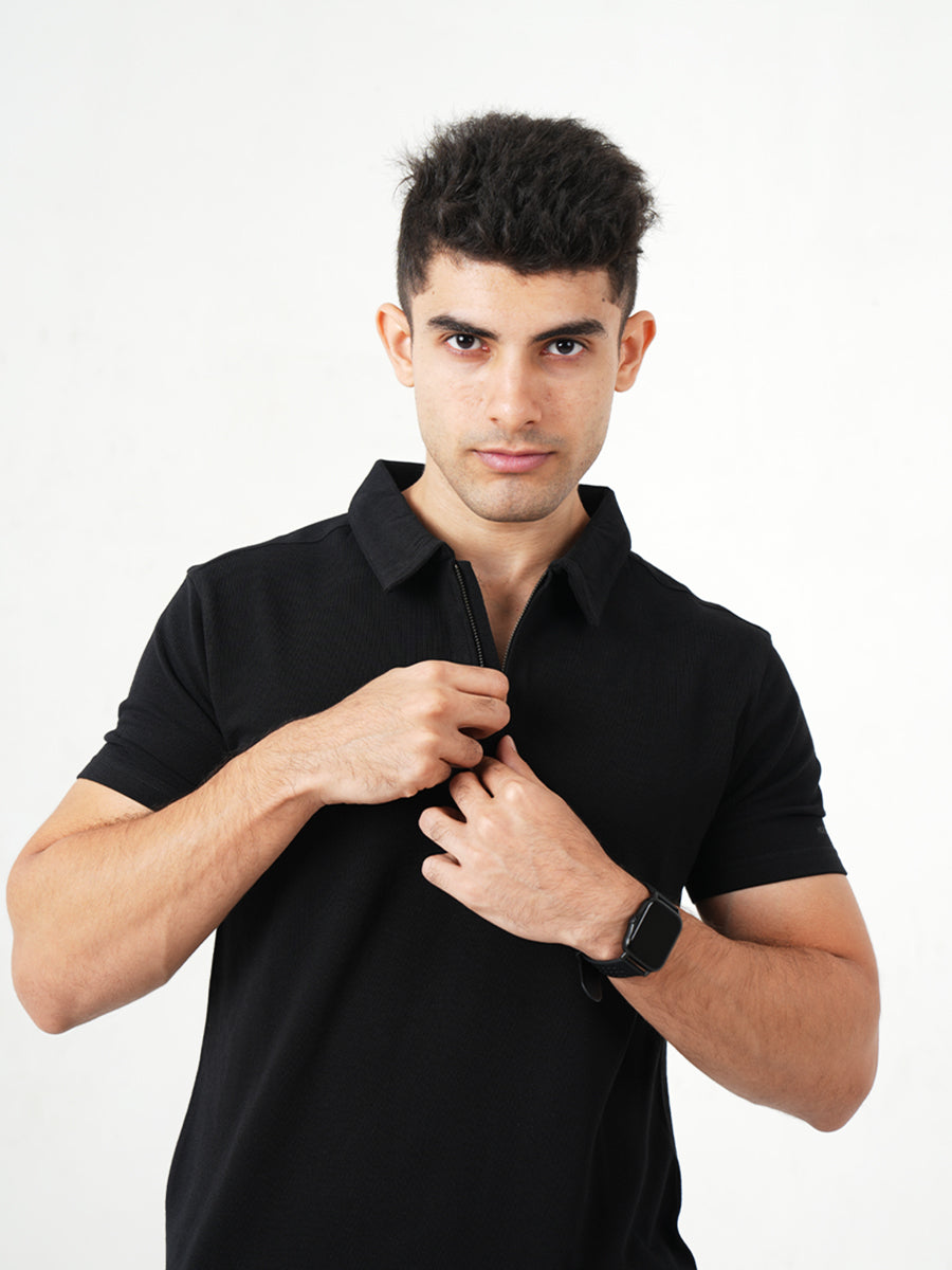 Monkstory young man posing in a Bamboo Cotton Zip-Polo Tee - Midnight Black.