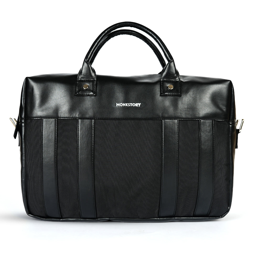 A Monkstory Timeless Laptop Bag - Black with storage options on a white background.