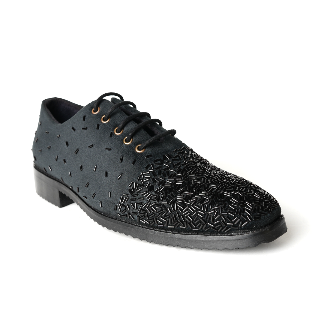 A stylish Monkstory Artisan Lace-Up - Black adorned with sequins, showcasing exquisite craftsmanship.
