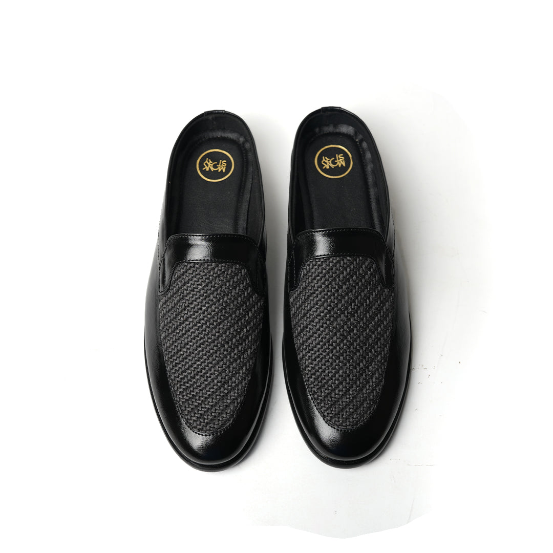 A Monkstory Half Mule Slipper - Black/Grey with a minimalist design and jute detailing.