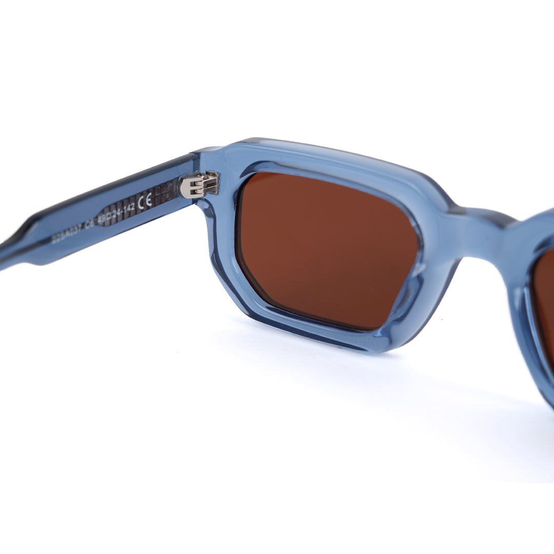 A pair of monkstory geometric acetate unisex sunglasses in transparent blue with brown lenses offering UV 400 protection.