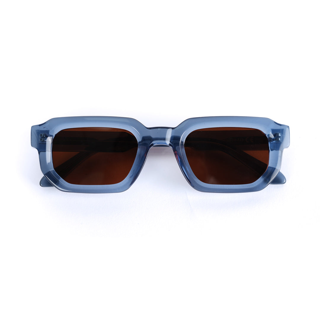 A pair of monkstory geometric acetate unisex sunglasses in transparent blue with brown lenses offering UV 400 protection.