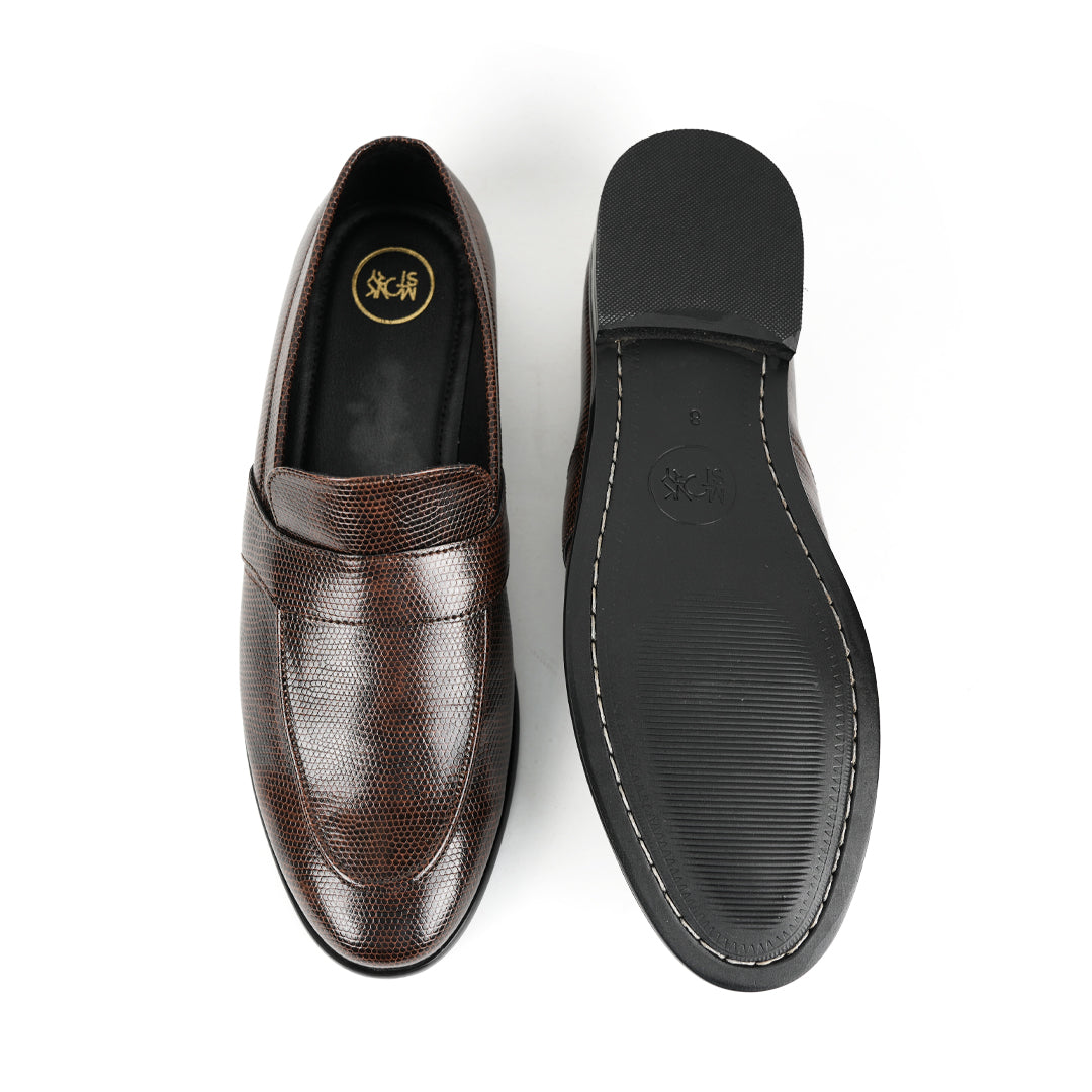 A stylish men's Monkstory brown loafer with a grain pattern on a white background.