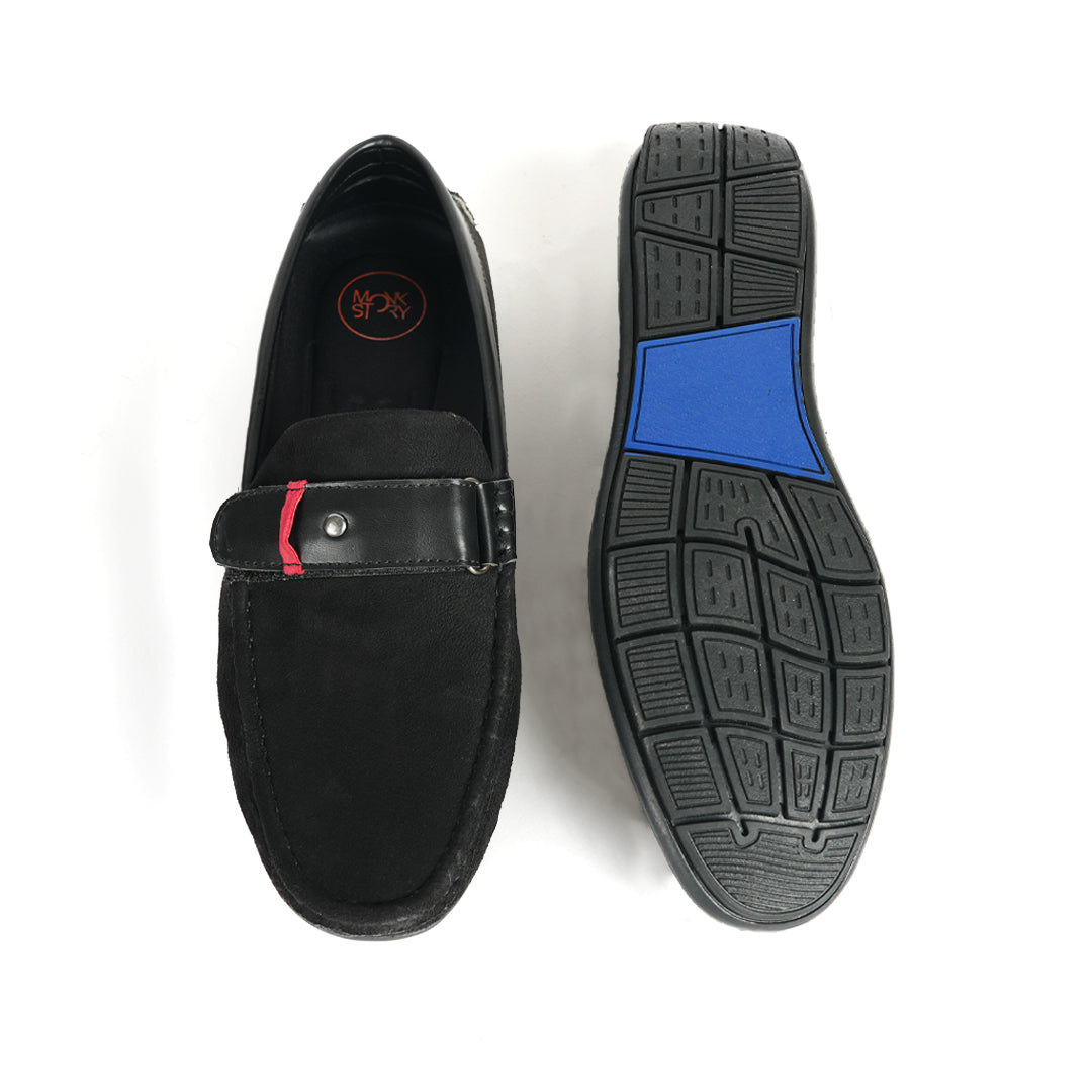 A comfortable Monkstory black loafer with a red stripe, perfect for driving.