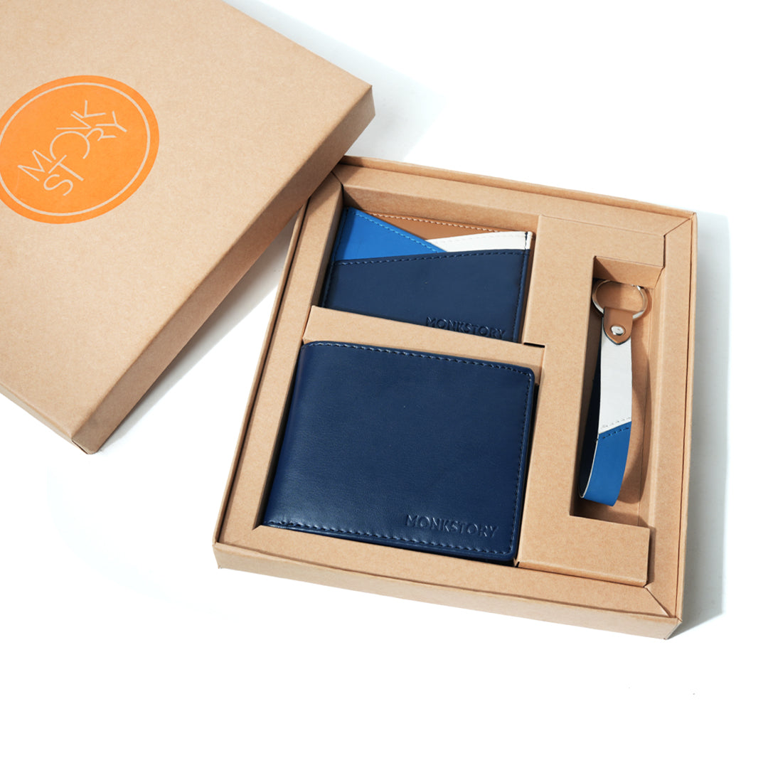 Handcrafted accessories, a blue Monkstory Signature Gift Box containing a wallet and key ring.