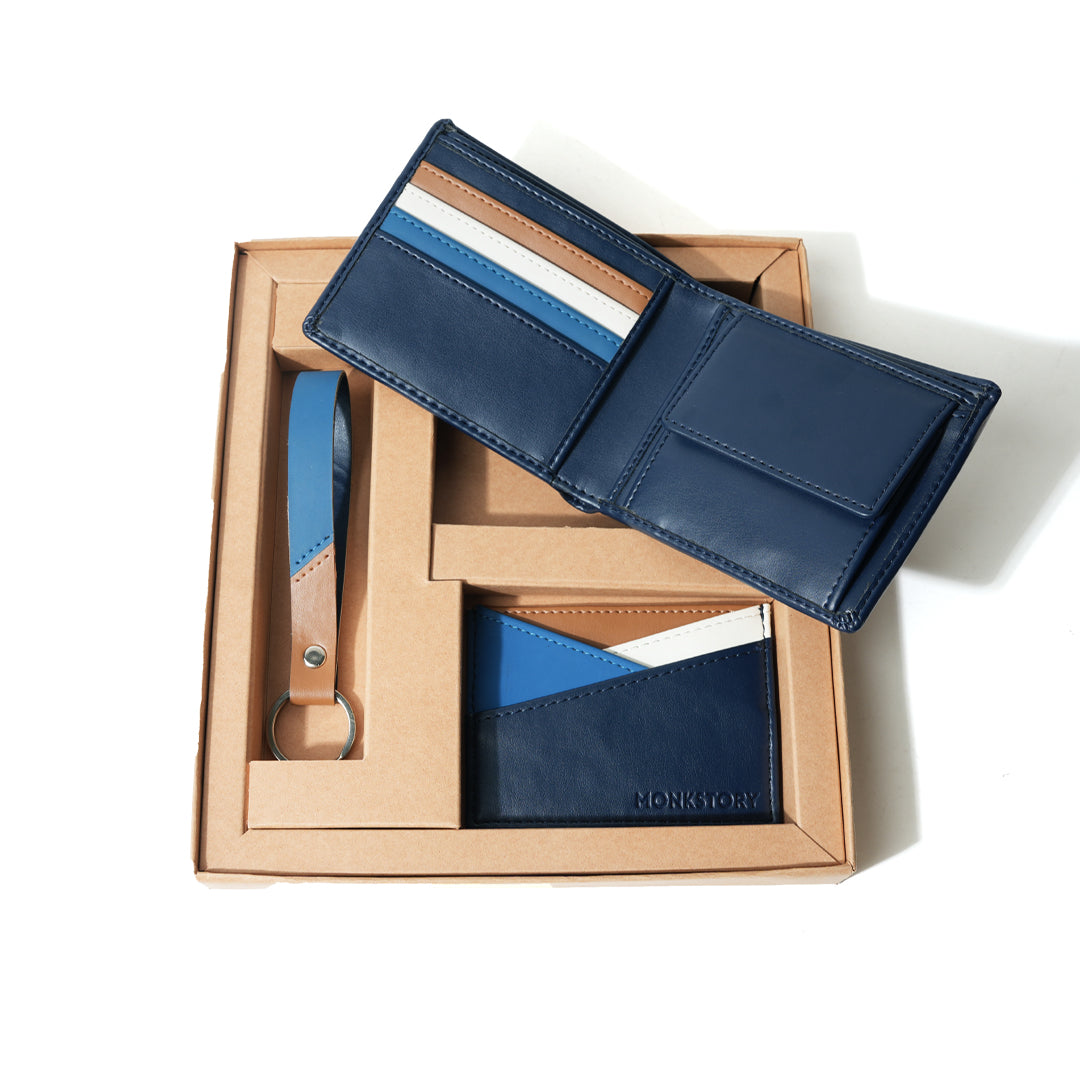 Handcrafted accessories, a blue Monkstory Signature Gift Box containing a wallet and key ring.