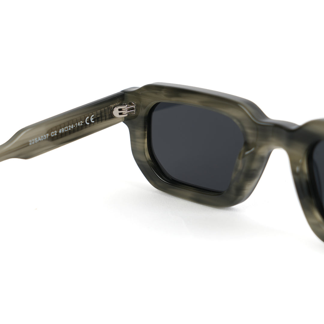 Monkstory sunglasses with a Marbleous Olive Grey frame and black lenses.