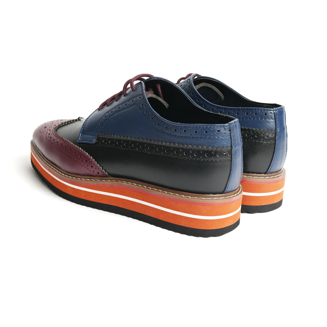 These stylish Monkstory Tricolour Brogues are men's wingtip oxford shoes with a navy blue, burgundy and black stripe. With their comfy colored sole, these head-turners are