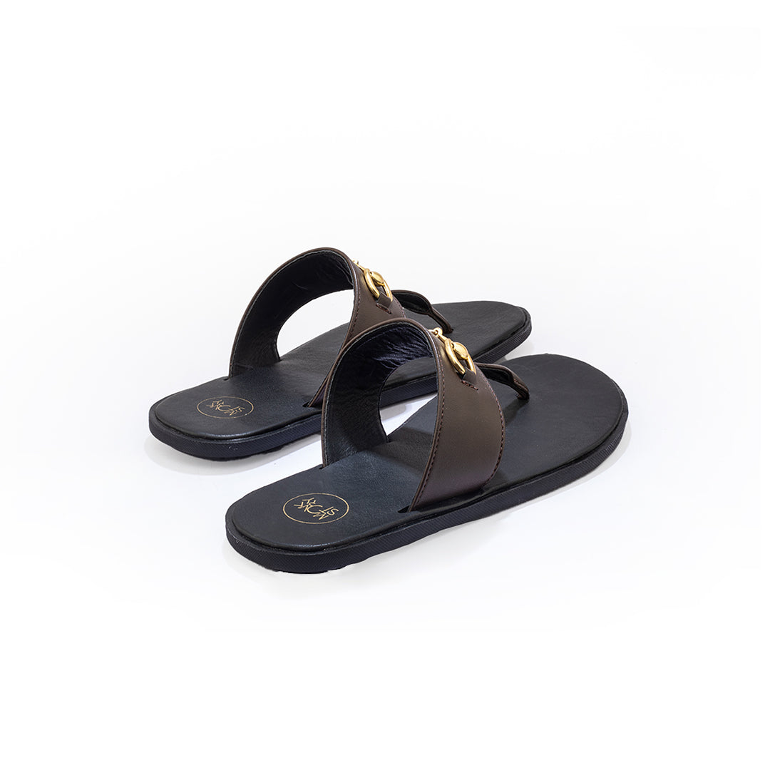 A pair of Monkstory T-Rad Horsebit sandals with gold buckles and grip-centric soles.