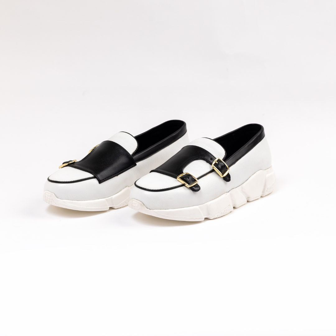 A stylish white/black Chunky Double Monk Sneaker from monkstory with two buckles.