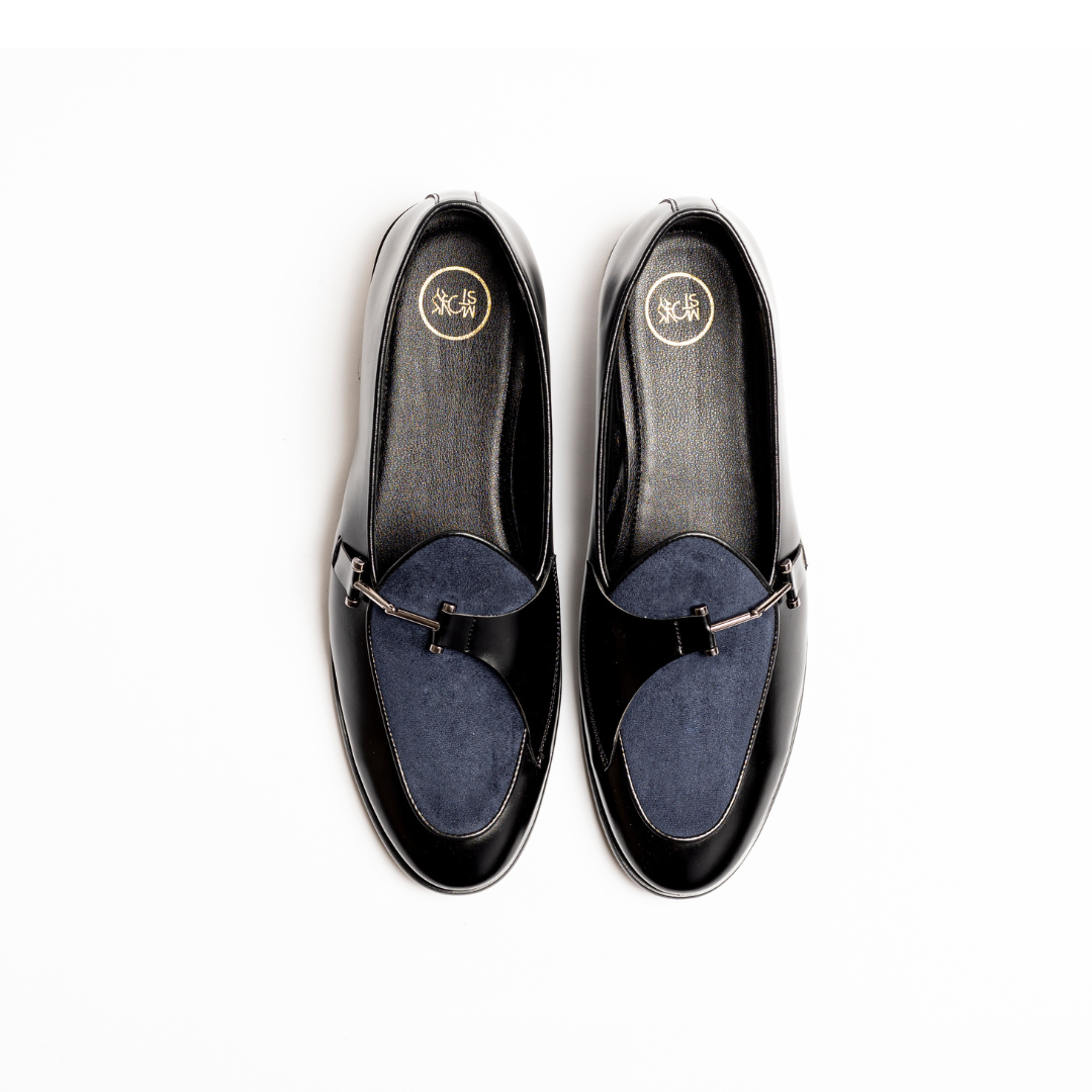 An Eclecta Side Buckle Slip Ons loafer in blue.