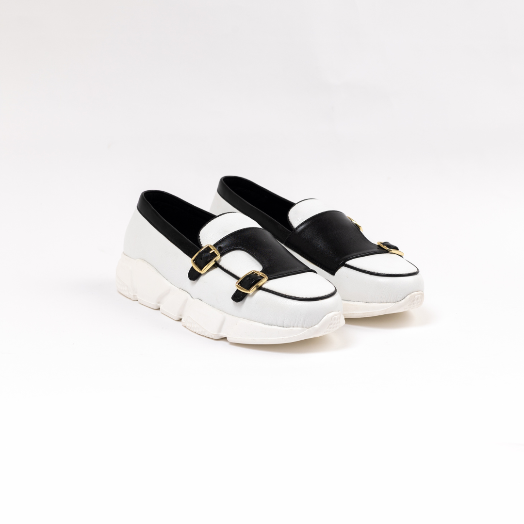 A stylish white/black Chunky Double Monk Sneaker from monkstory with two buckles.