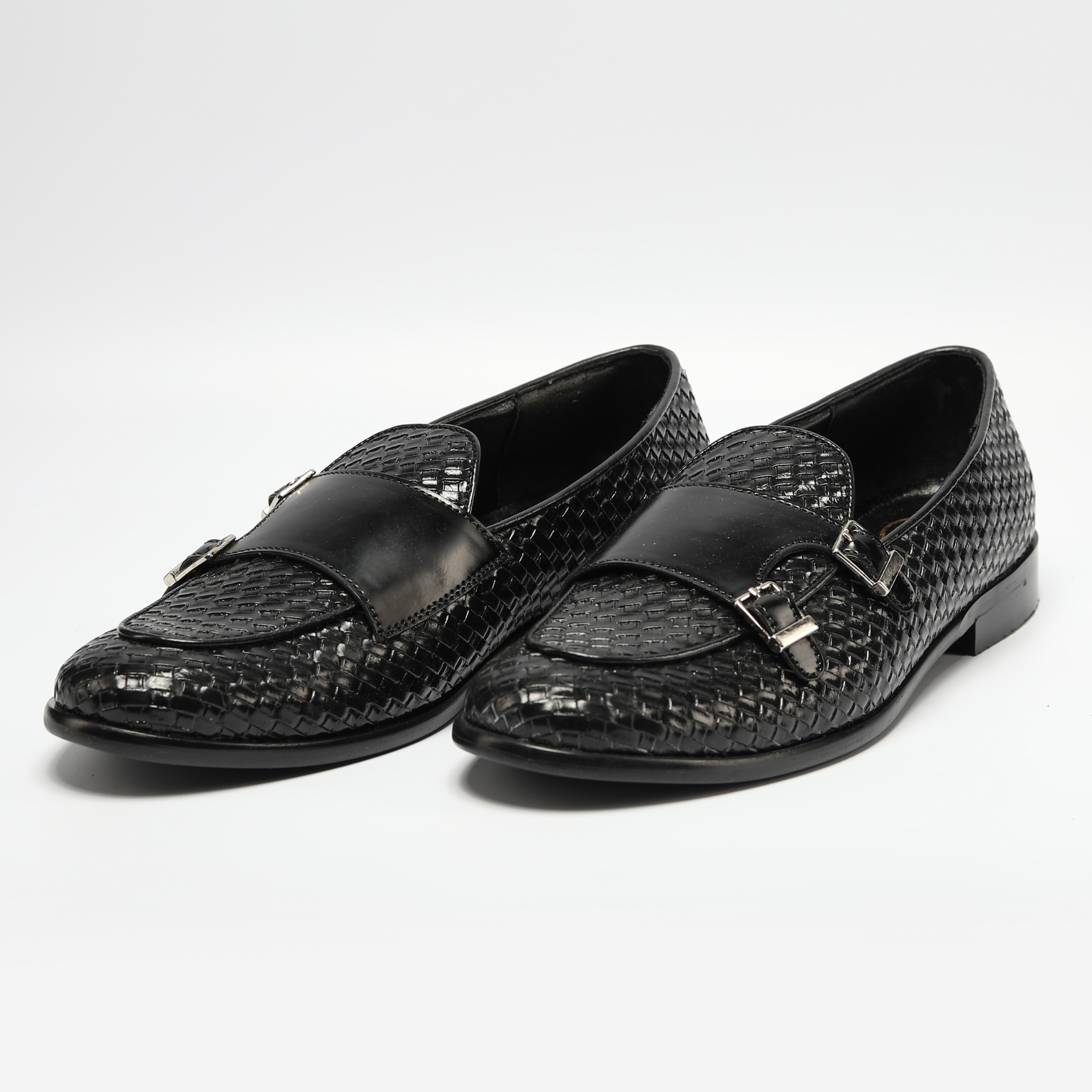 A black braided double monk slip on with a metal buckle and mini buckles - Monkstory Magnificos.