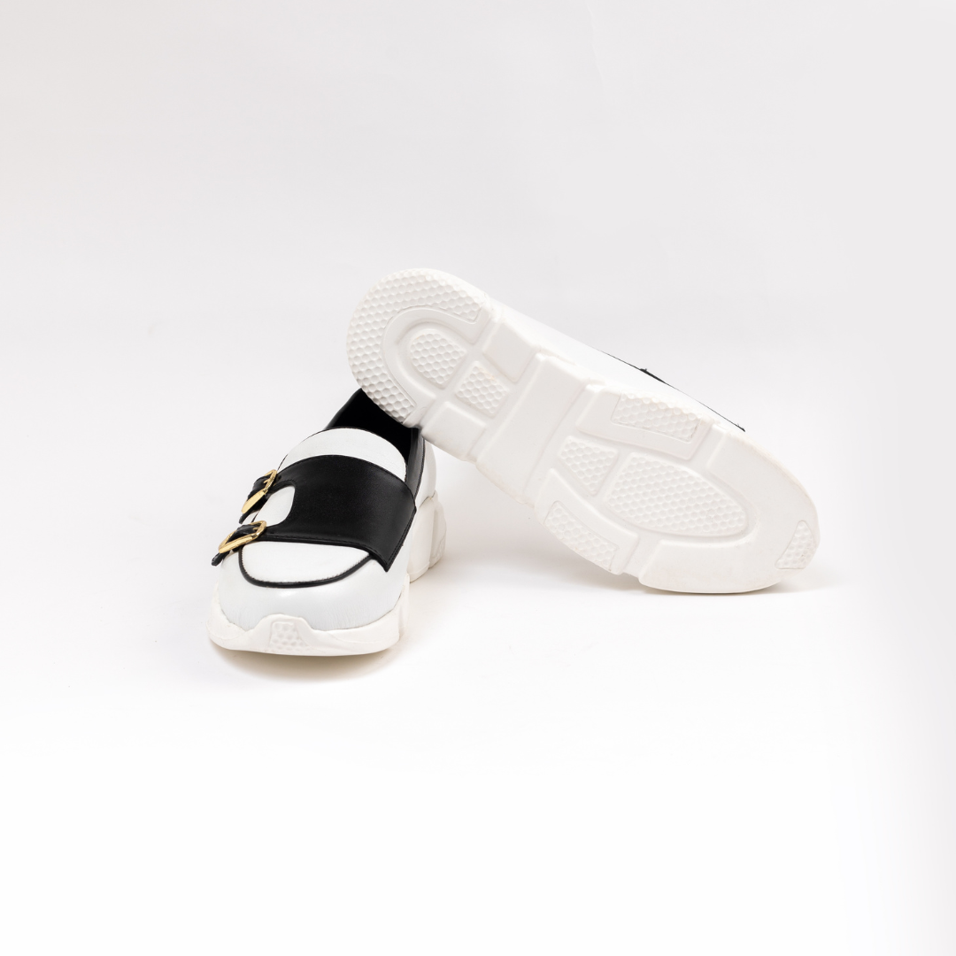A stylish white/black Chunky Double Monk Sneaker from monkstory with two buckles.