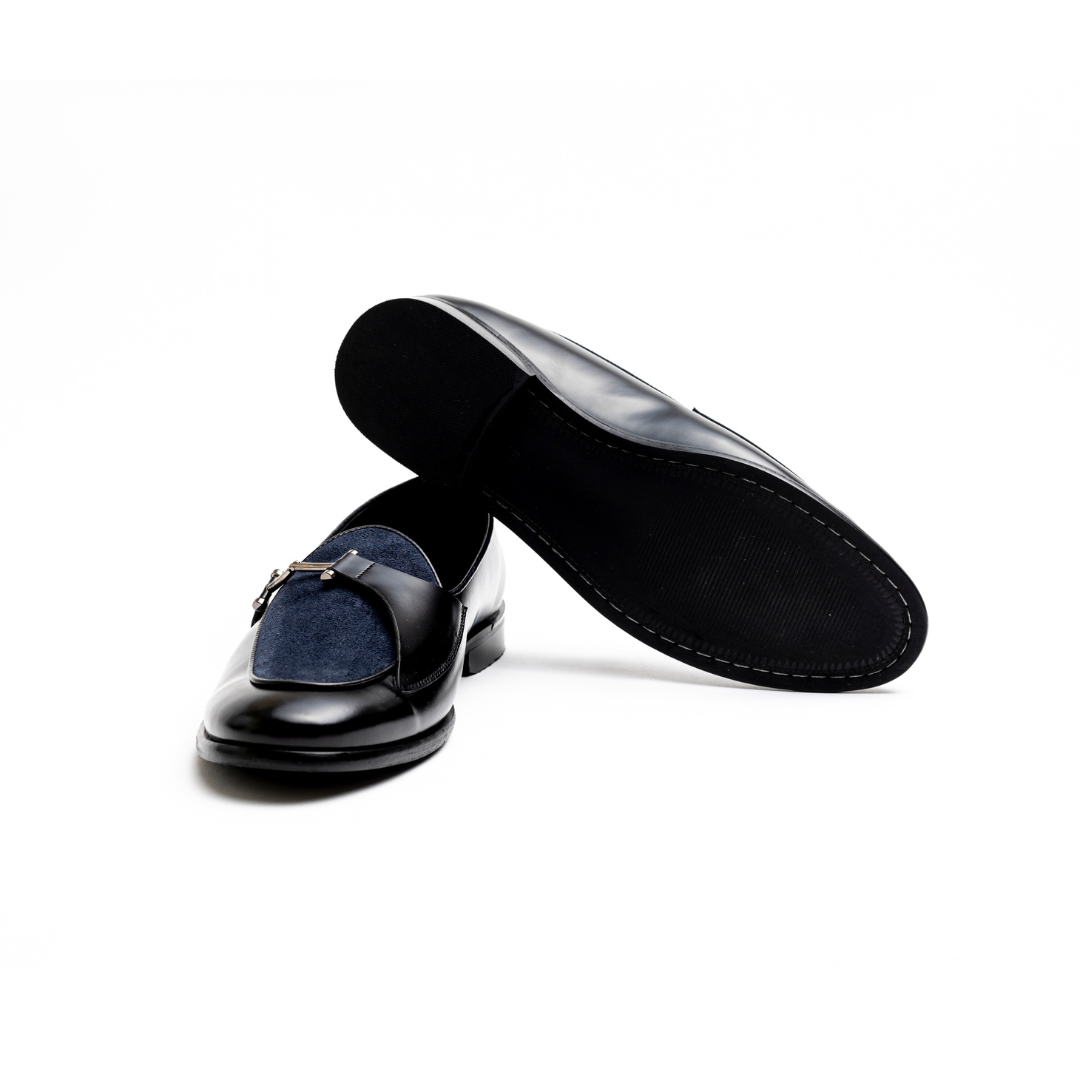 An Eclecta Side Buckle Slip Ons loafer in blue.