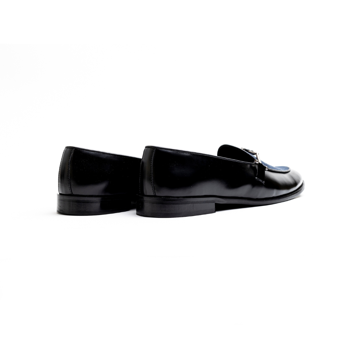 An Eclecta Side Buckle Slip Ons loafer in blue.