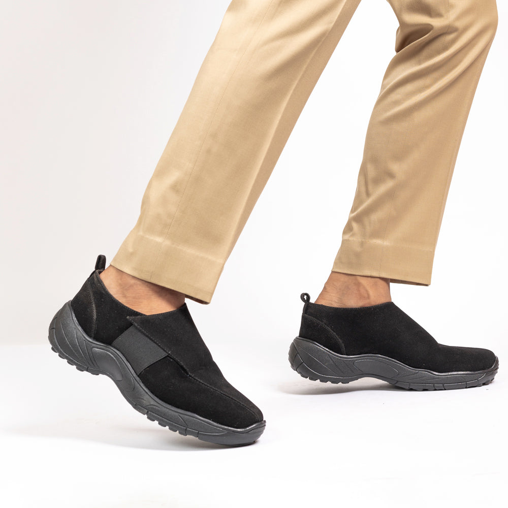An elegant black slip on shoe, perfect for work wear, featuring a comfortable and sleek design, showcased against a white background.