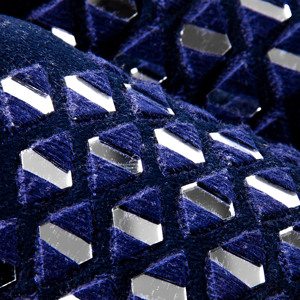 A pair of stylish Mirror Mojari - Royal Blue shoes with holes.
