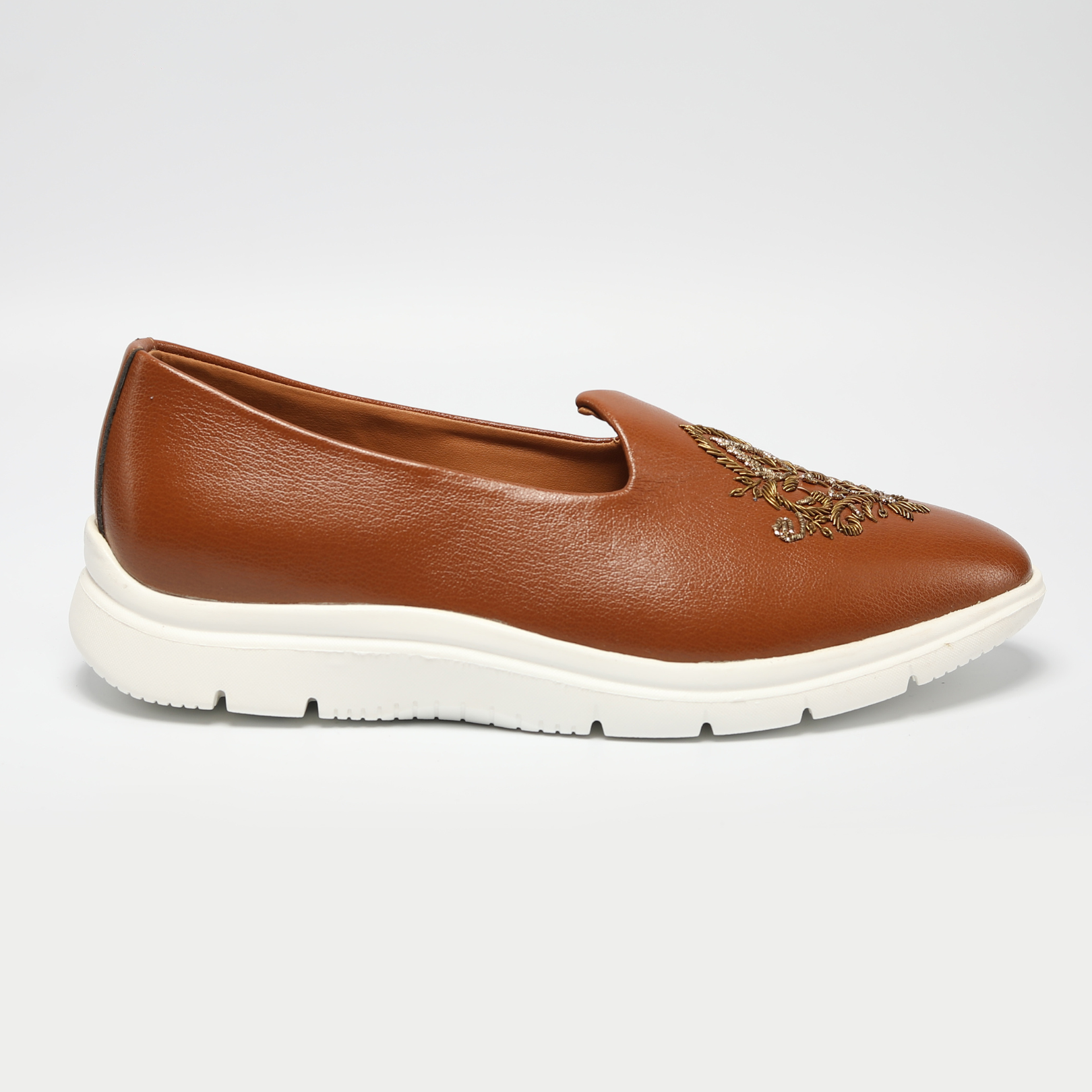 An ethnic design ReMx Mojari Sneakers - Tan with embroidered detailing, perfect for a festive occasion by Monkstory.