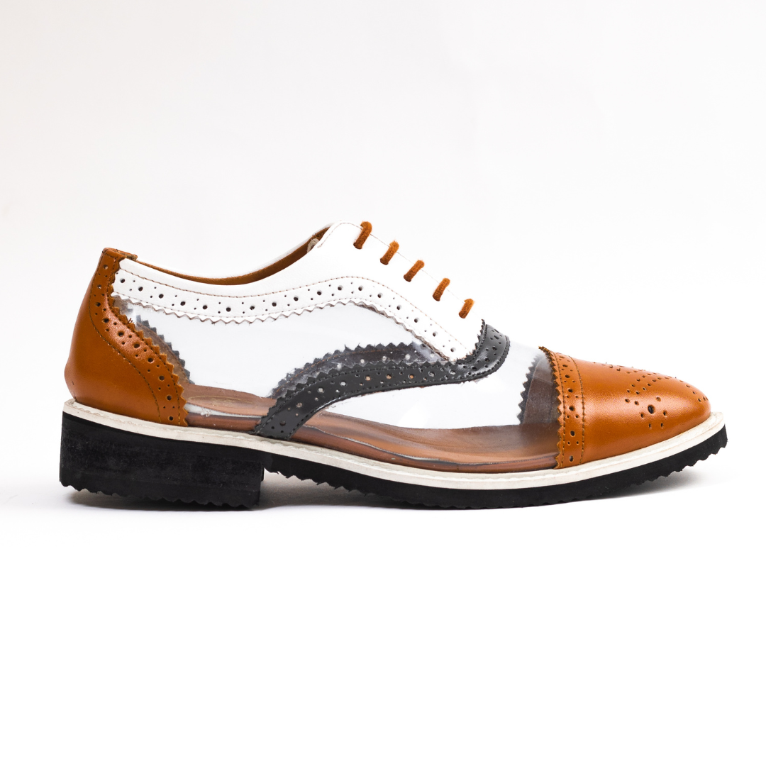 A pair of brown and white Trance Tricolour Transparent Brogues with clear soles made from PU Leather.