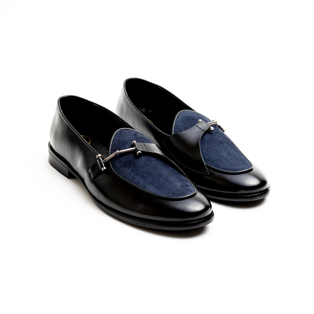 An Eclecta Side Buckle Slip Ons loafer in blue.