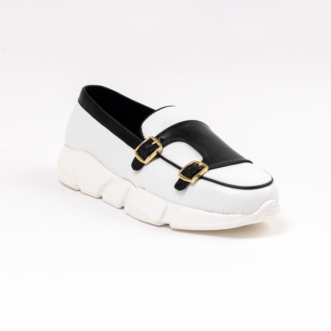 A stylish white/black Chunky Double Monk Sneaker from monkstory with two buckles.