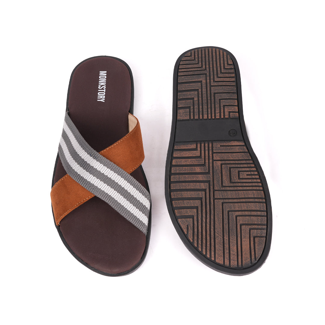 A pair of monkstory grey striped strap sandals in brown and tan.