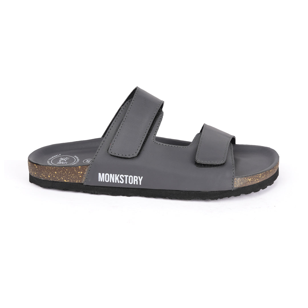 A pair of Monkstory Dark Grey Cork Dual-Straps Sandals, comfortable and stylish.