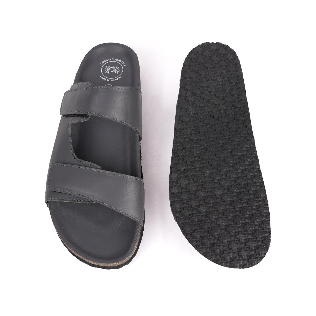 A pair of Monkstory Dark Grey Cork Dual-Straps Sandals, comfortable and stylish.