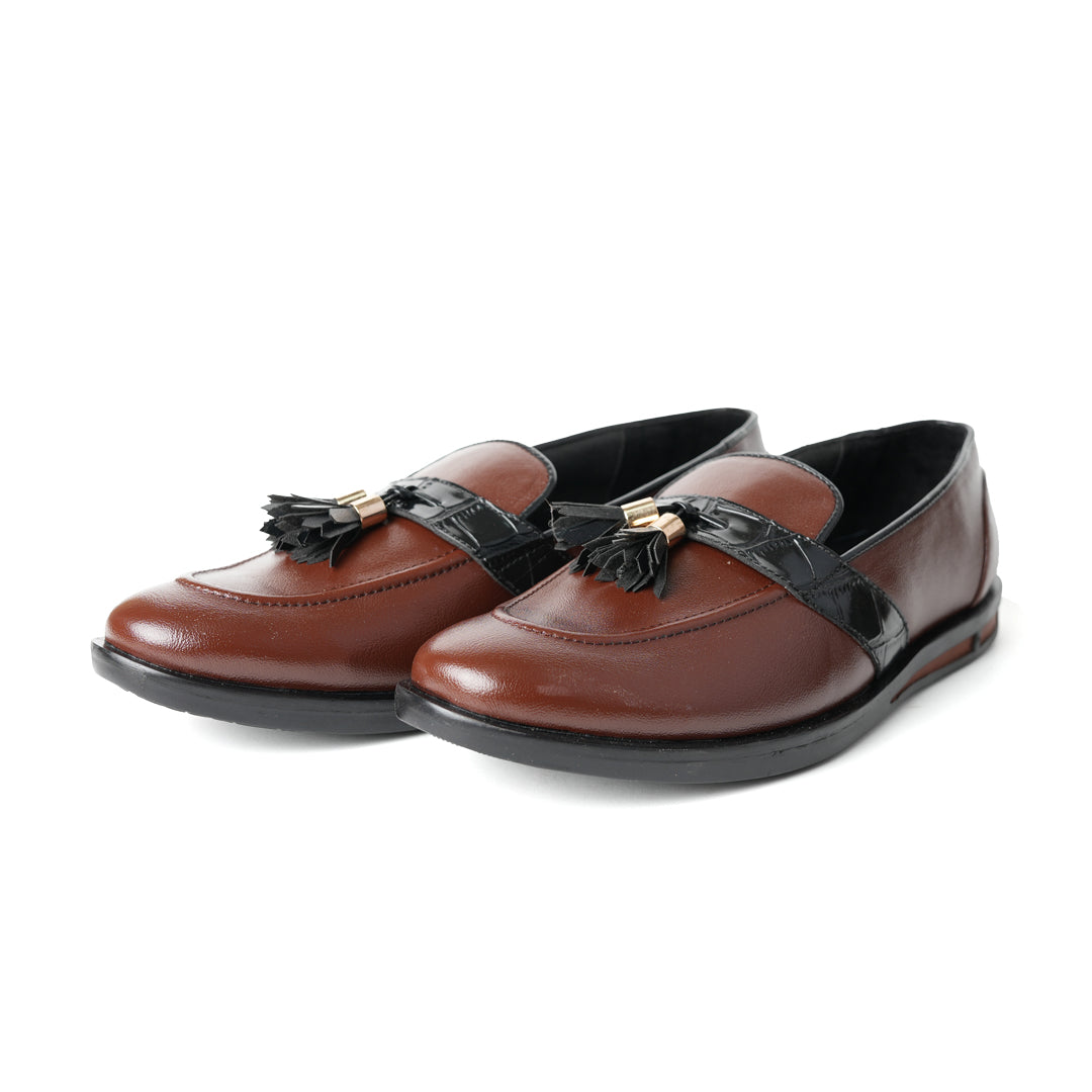 Flatform Metallic Tassel Slip Ons - Brown, by Monkstory, are a pair of loafers with faux leather.