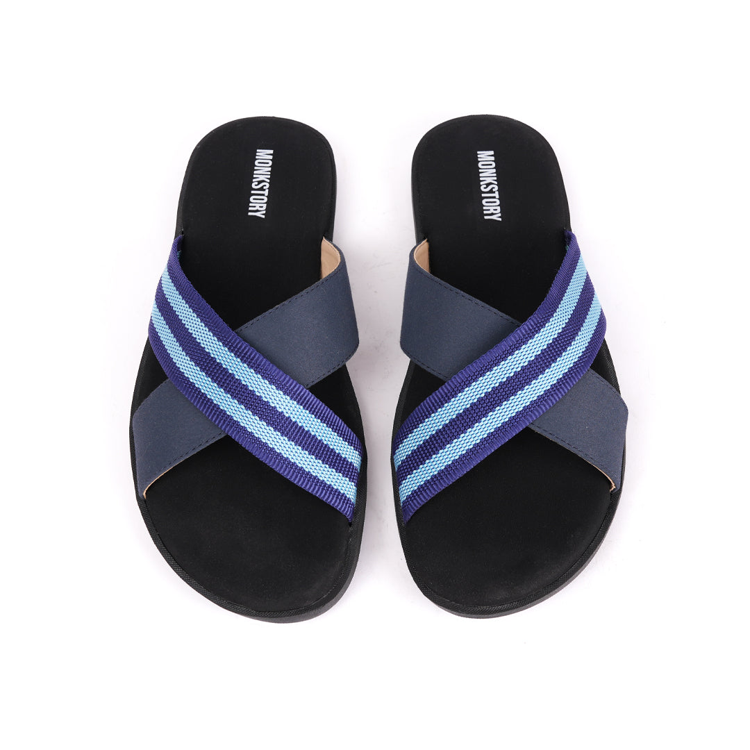A pair of Monkstory Blue Striped Strap Sandals for men in a black, grey, and blue color combination. These flip flops are snug and comfortable.